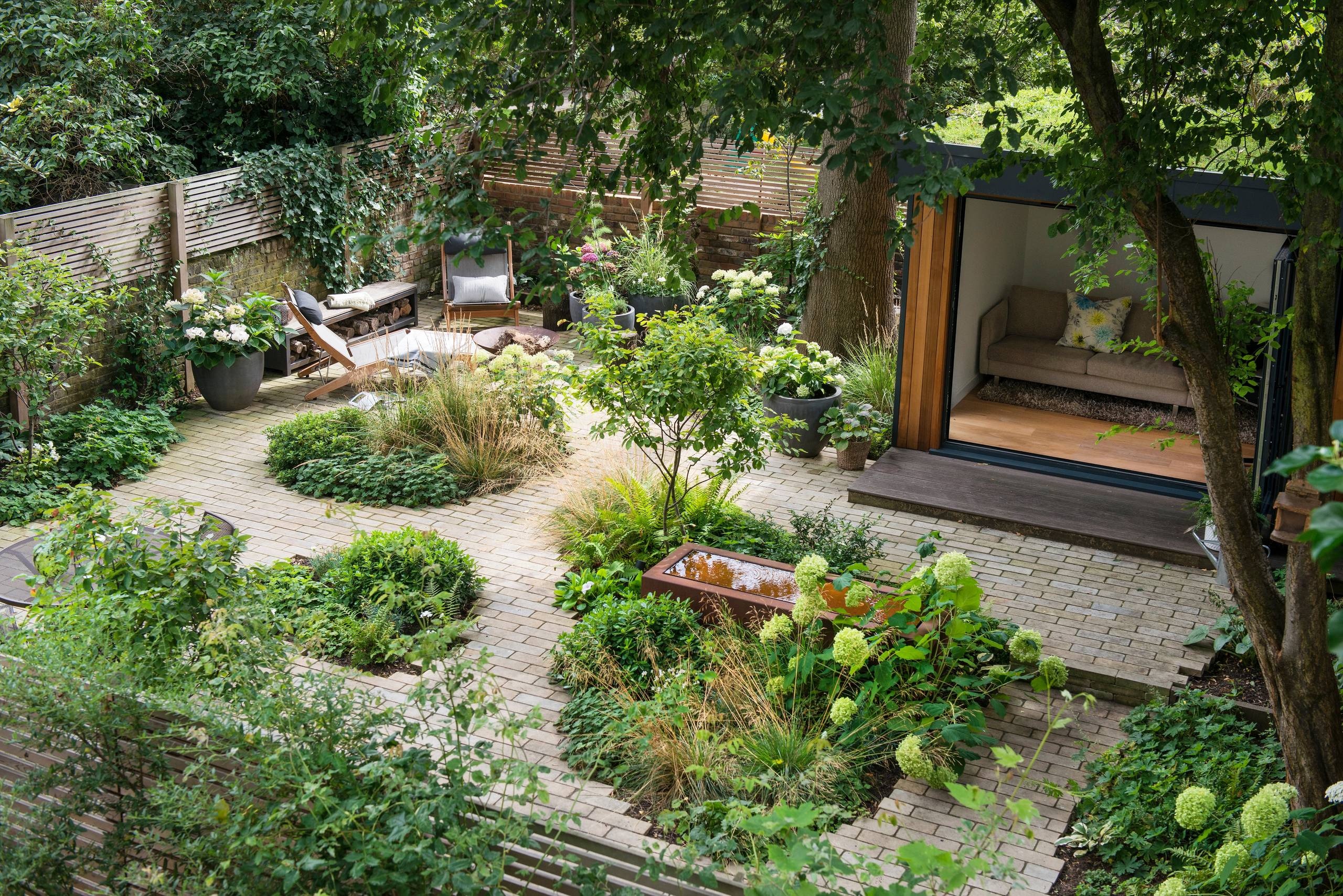 Outdoor living and garden of restoration featuring native plants and peaceful walkways